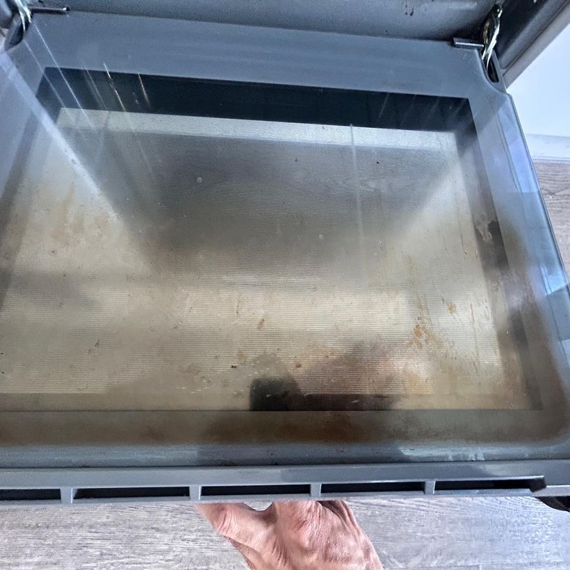 Oven door glass before cleaning